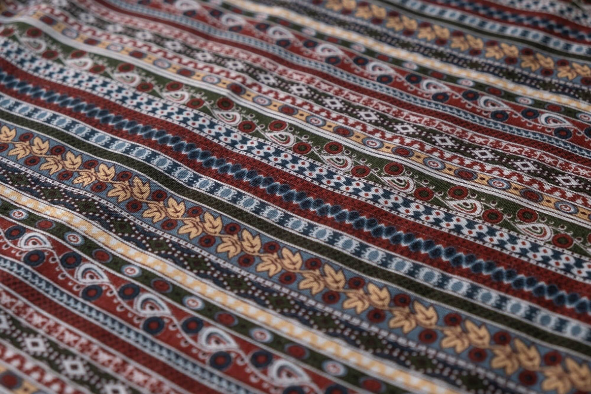 Multicolor rayon wide-leg pants fabric with geometric stripe and border pattern
