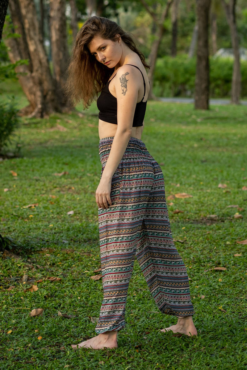 Multicolor patterned rayon pants with wide-leg silhouette and elastic waist, standing