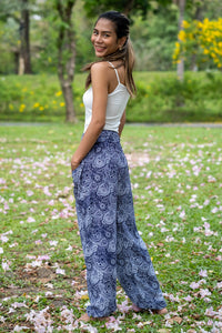 Wide-leg flow pants in dark blue with white paisley print, relaxed drape