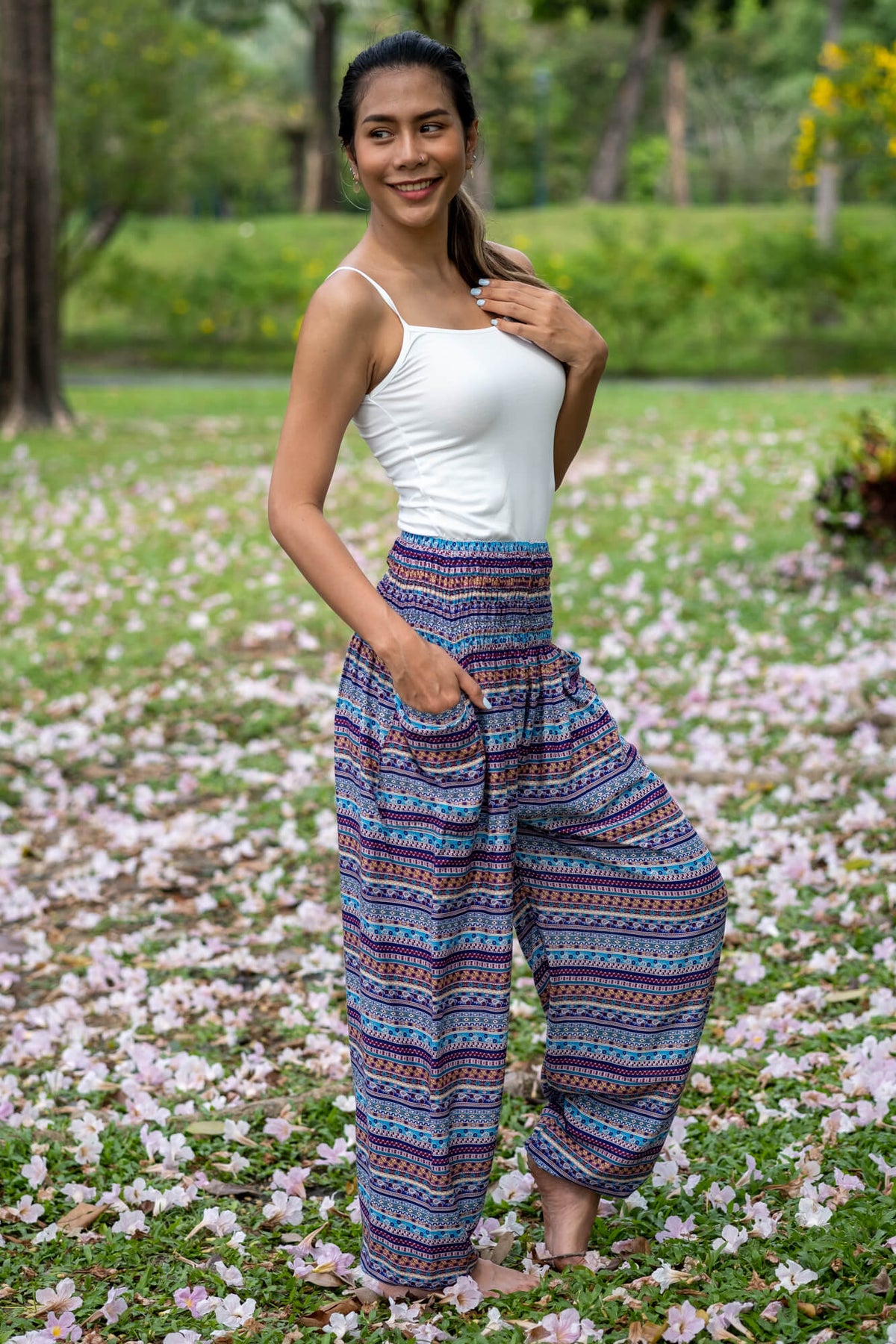 Multicolor rayon pants with wide-leg drape, blue base and patterned stripe print.